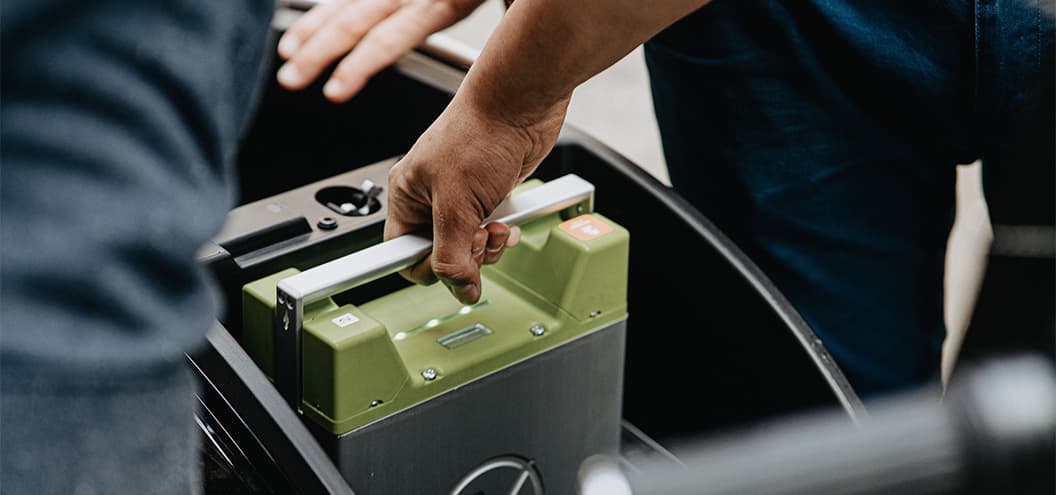 Car Battery being picked up