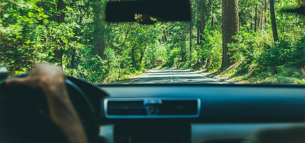 View of road from front windshield of car