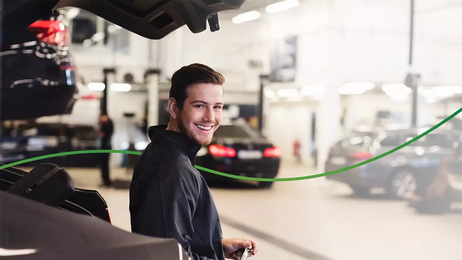 Smiling mechanic at an auto shop