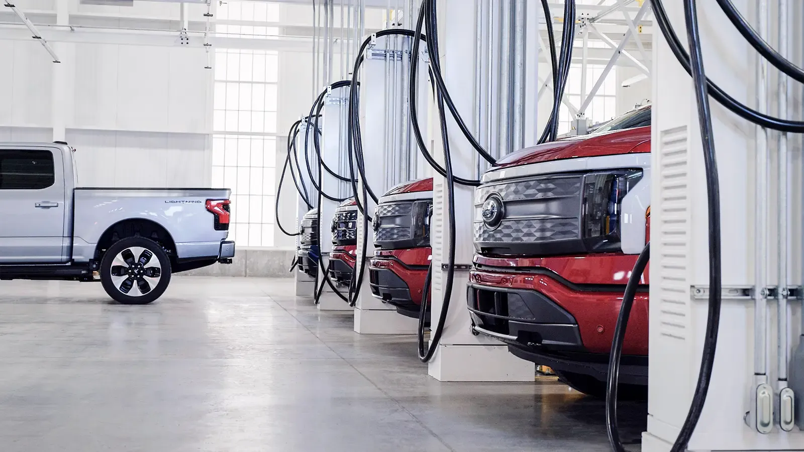 Ford Lightning trucks parked in garage