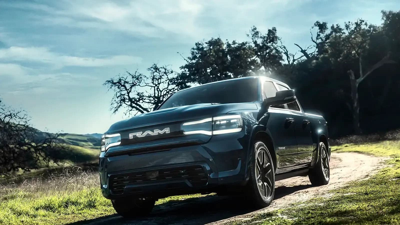 Ram 1500 REV driving on dirt road