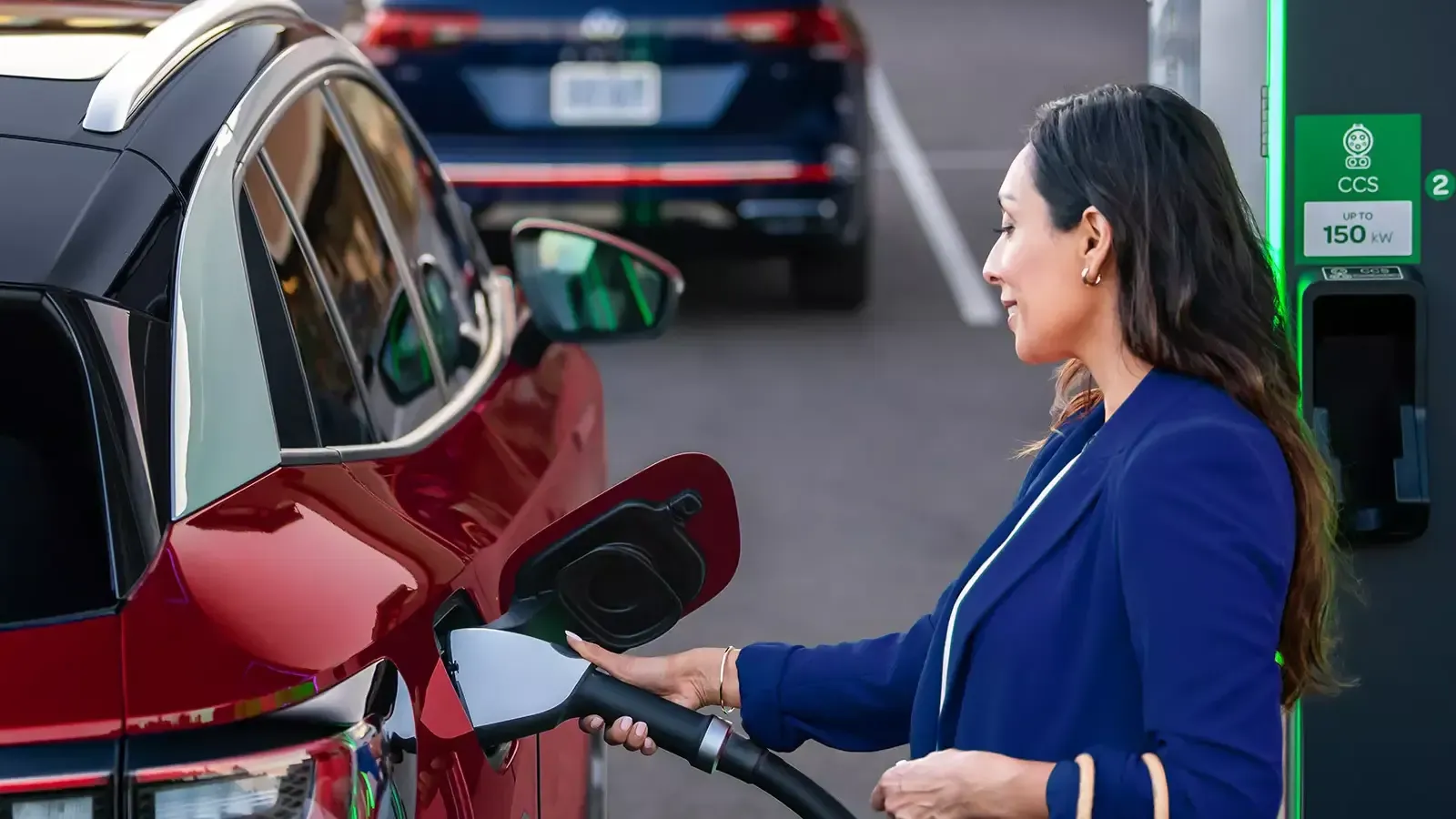 woman charging her Volkswagen ID.4 car 