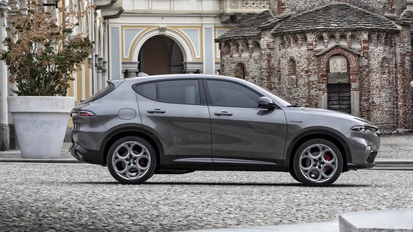 Plug-In Hybrid Alfa Romeo Tonale Side Profile on Cobblestone