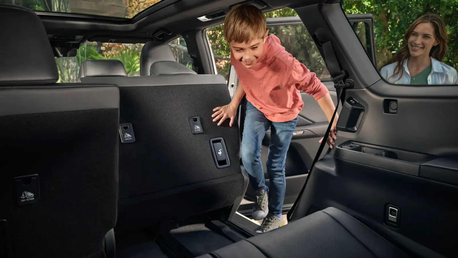 Child climbing into the third row of a Lexus TX