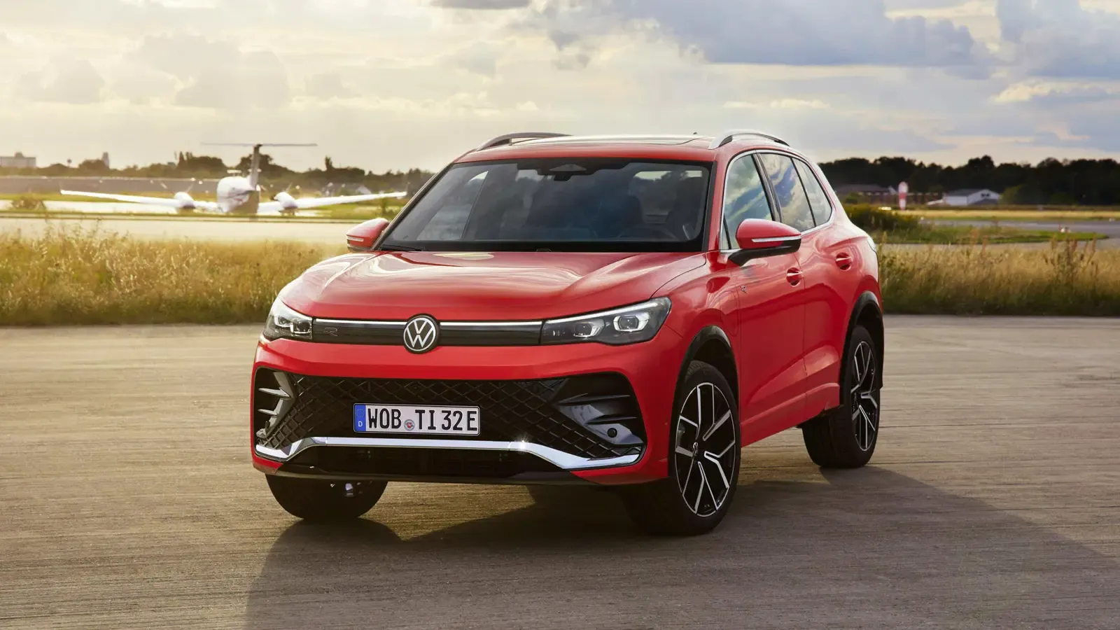 VW Tiguan in red front exterior on the road 
