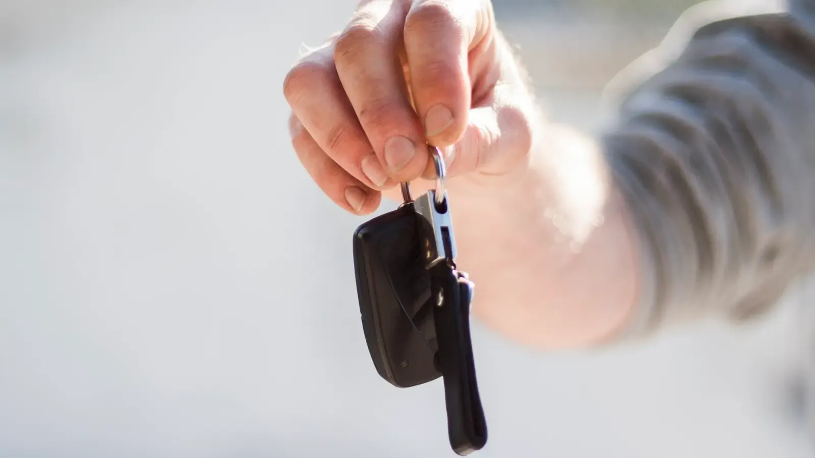 Person holding car keys