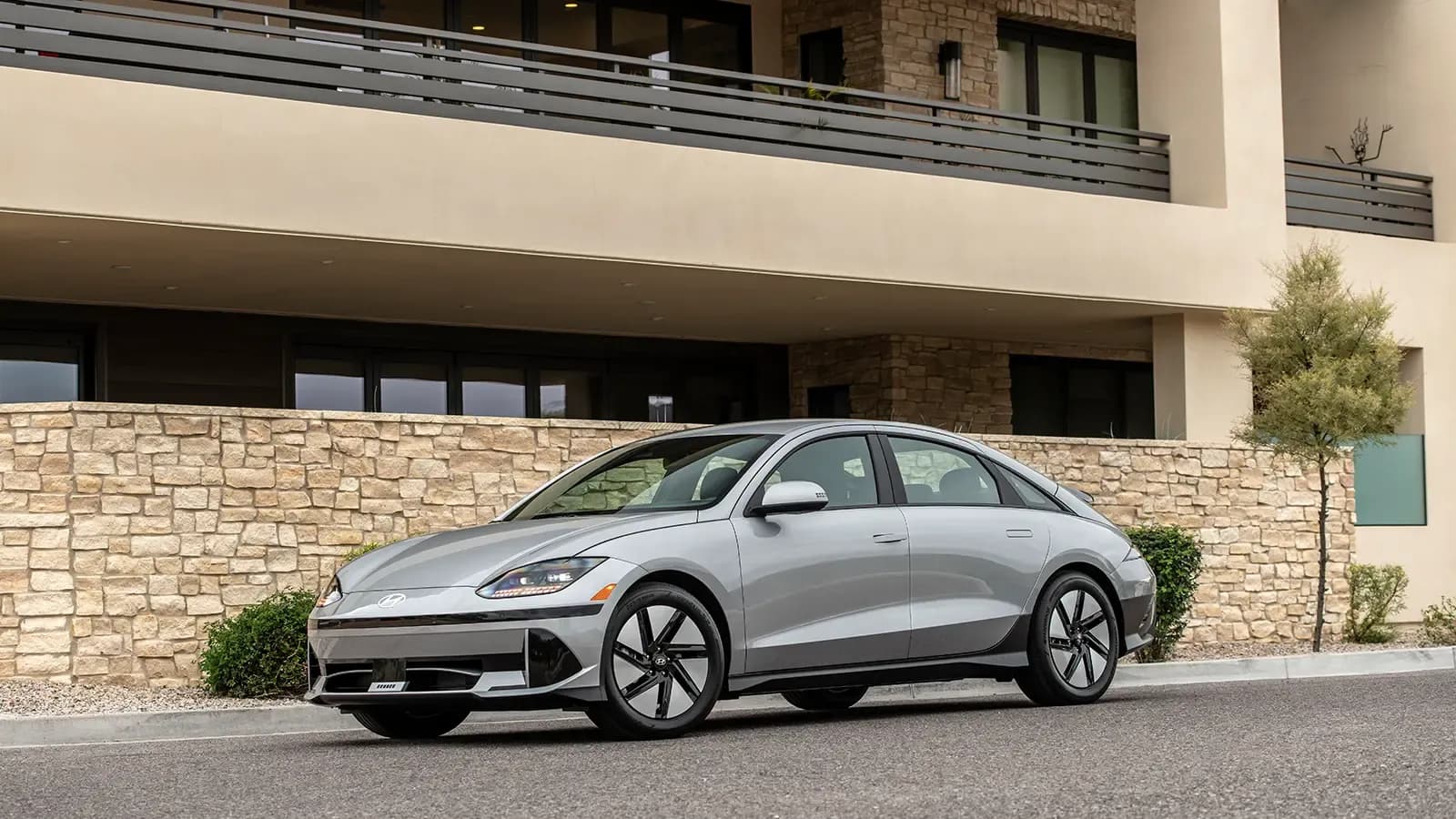 Hyundai Ioniq 6 EV parked by a house