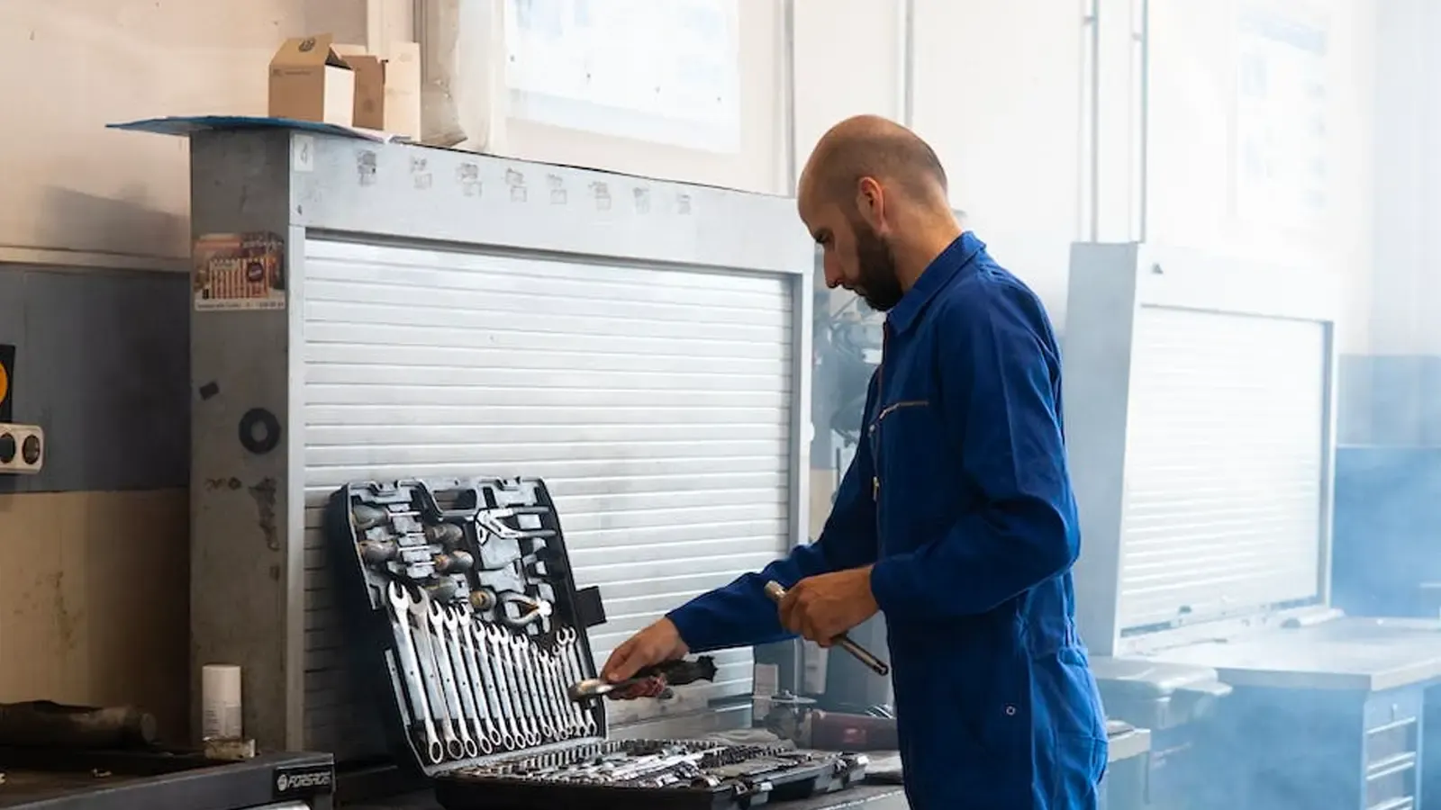 Man repairing an EV