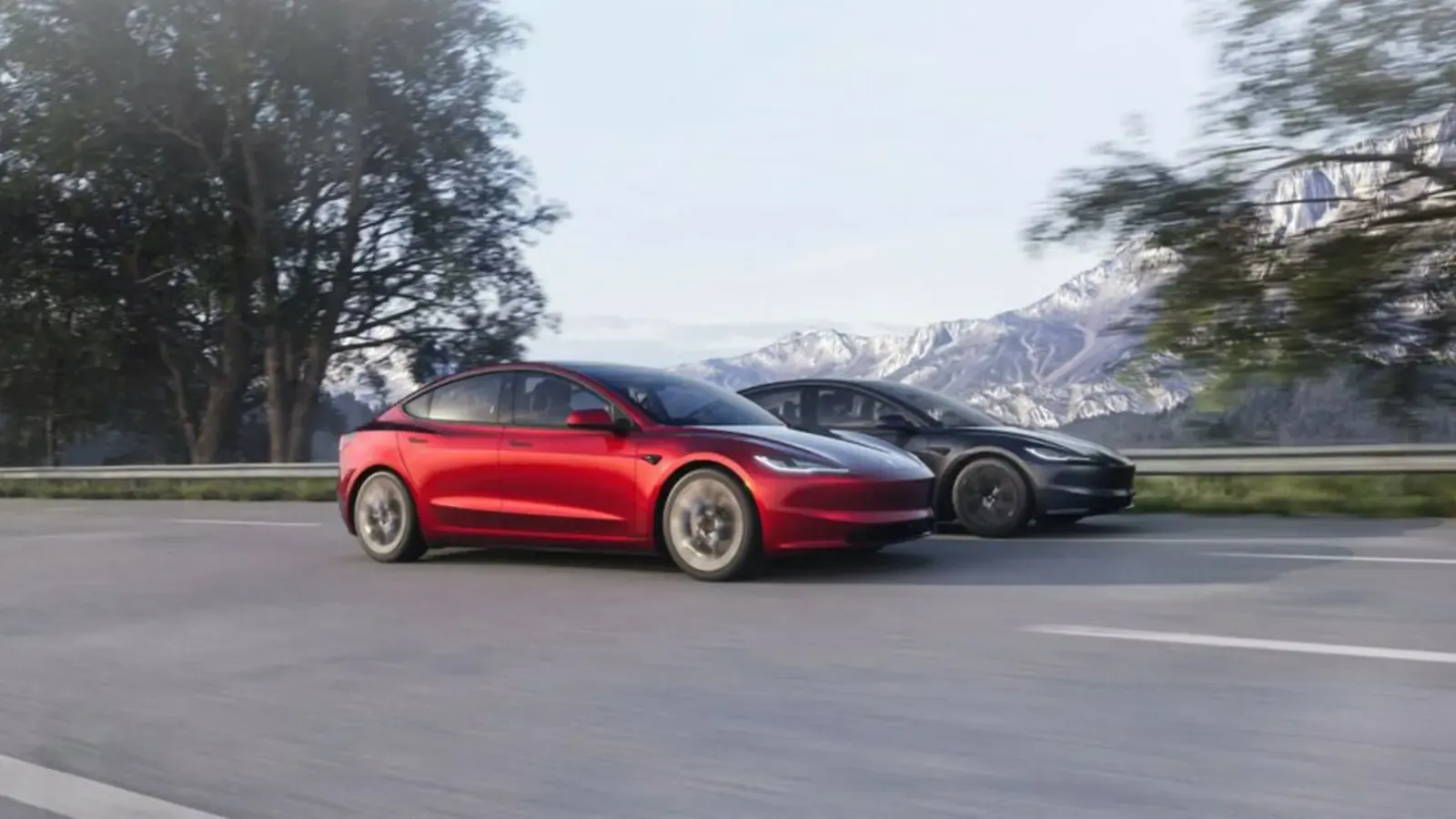 Two Tesla Model 3 cars driving on the road 