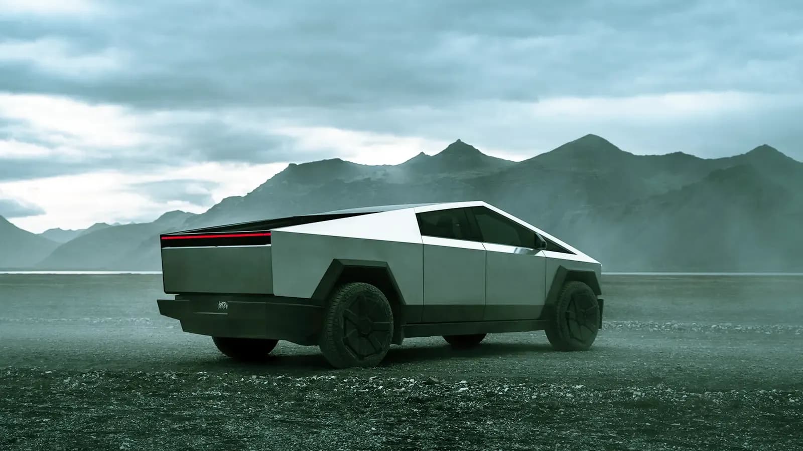 Tesla Cybertruck exterior view by a mountainous landscape 