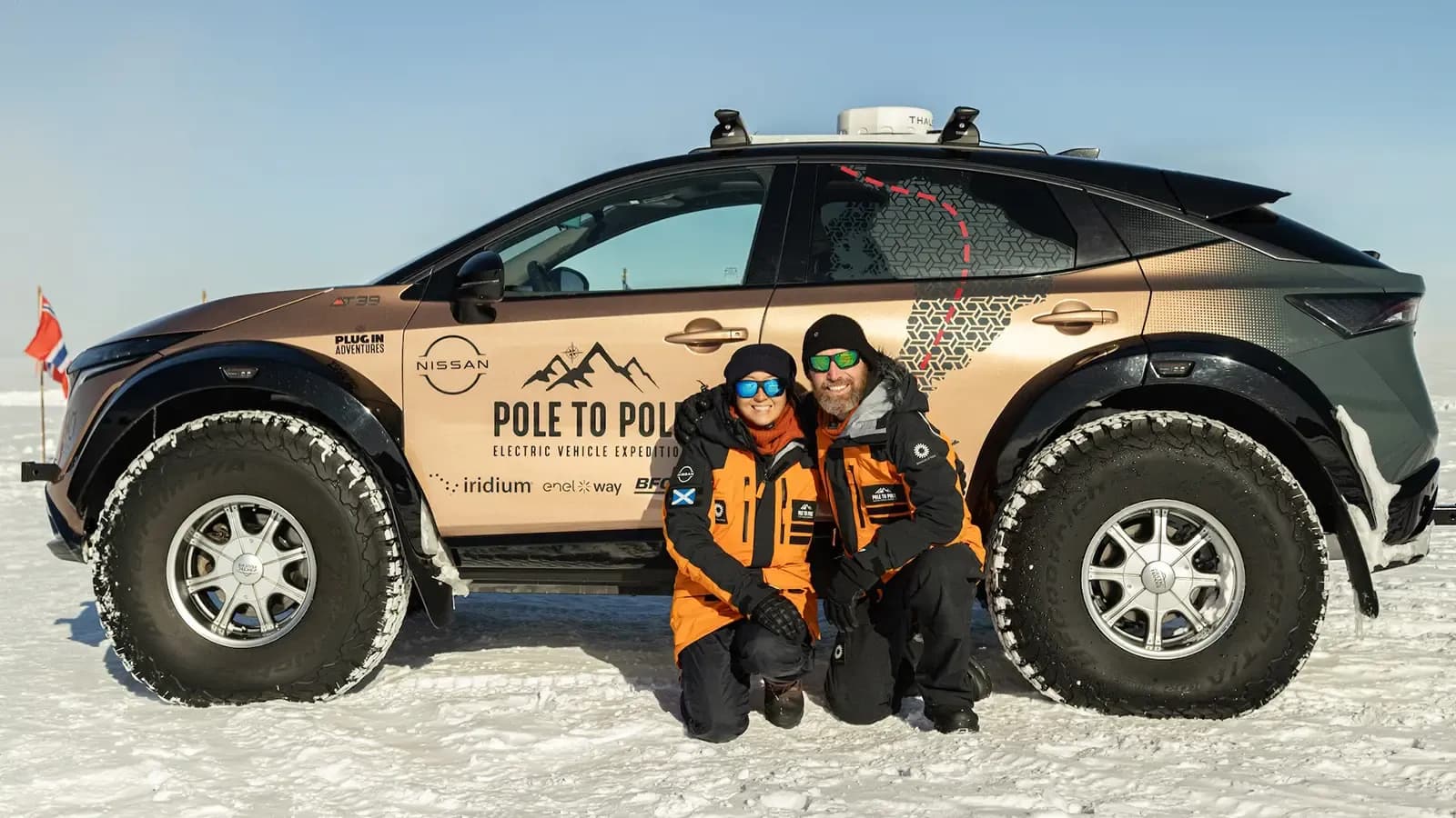 Chris and Julie Ramsey, husband and wife adventurers and their Nissan Ariya they used on their pole to pole expedition 