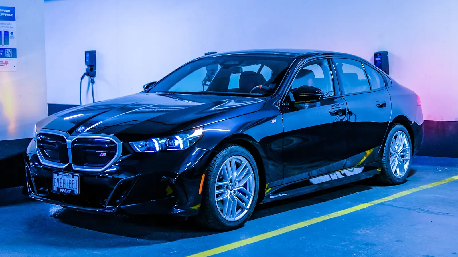 BMW i5 m60 Electric Sedan exterior view in parking lot garage 
