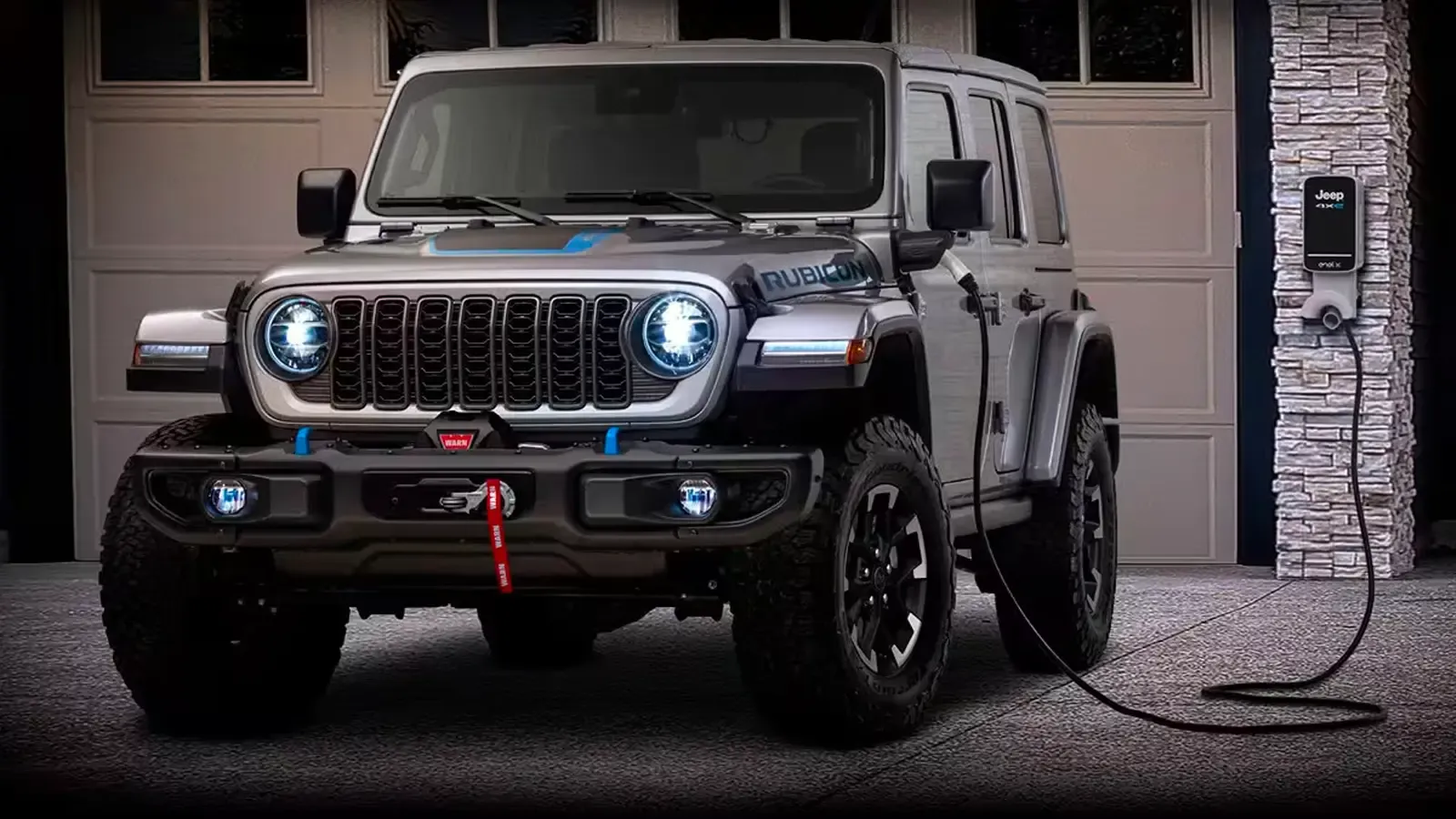 Jeep Wrangler 4xe hybrid charging by a garage 