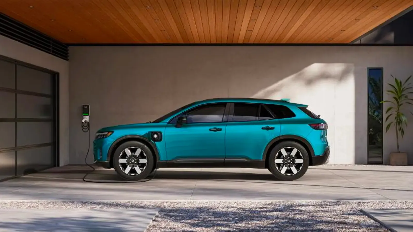 2024 Honda Prologue being charged in a home garage 