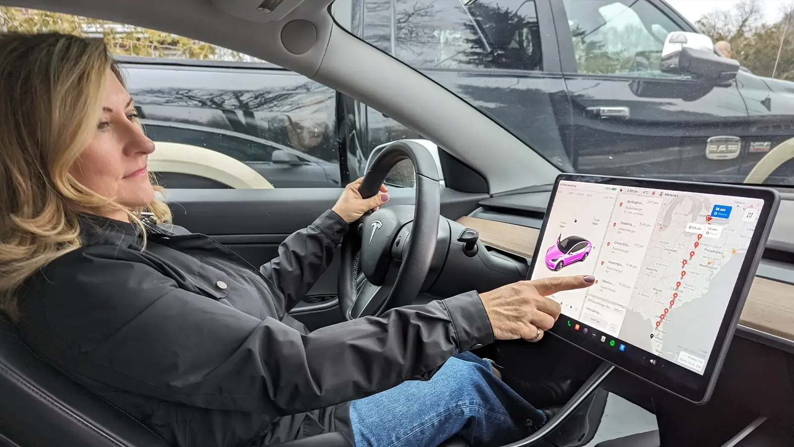 Woman using Tesla navigation features