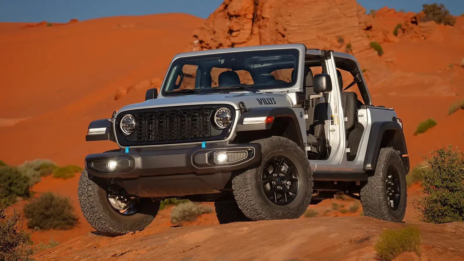 Jeep Wrangler 4xe driving on a dirt path