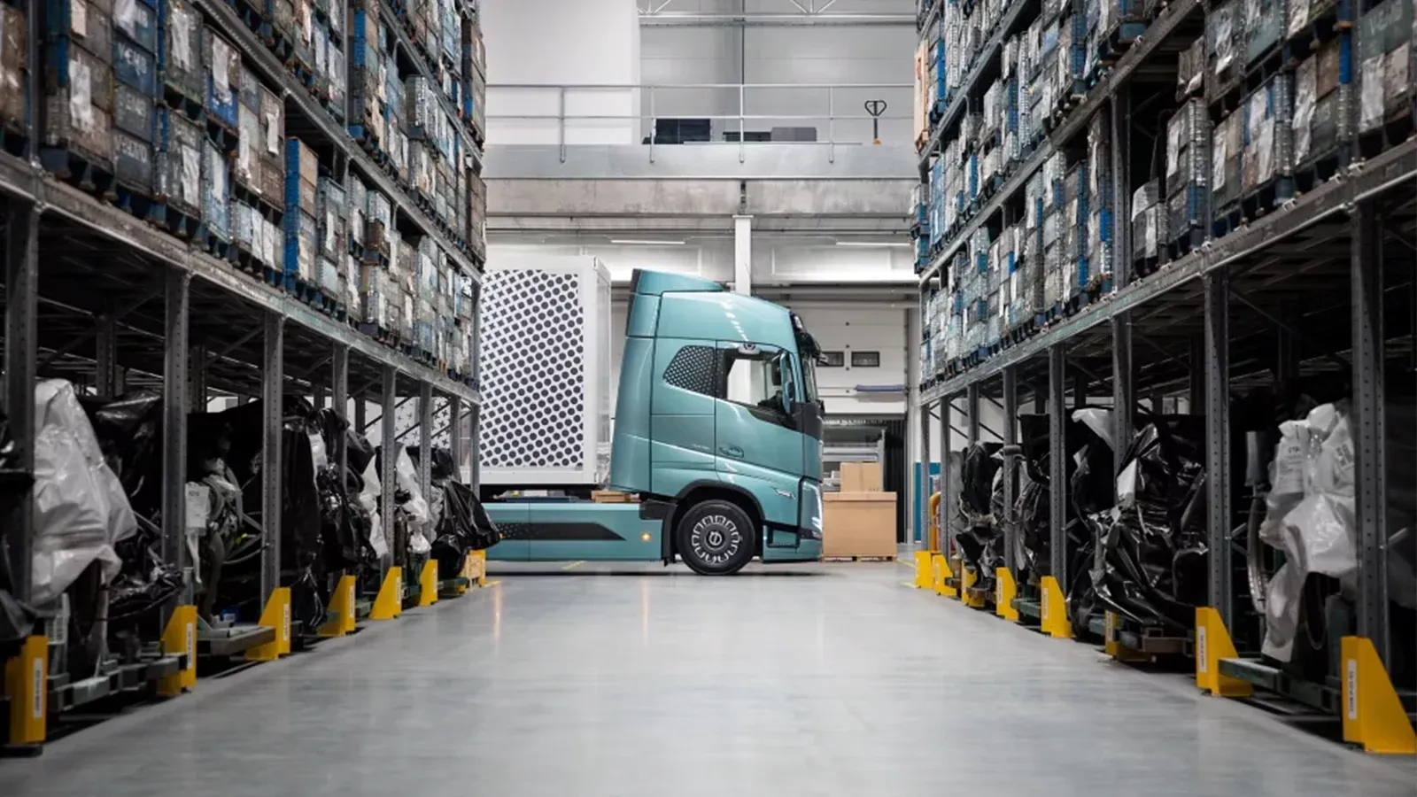 electric semitruck navigating through an indoor warehouse