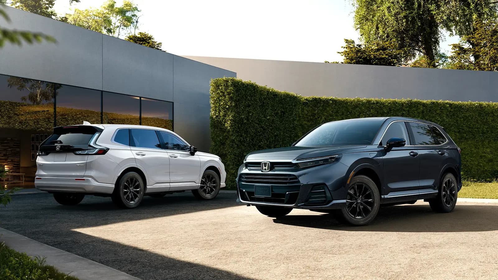 two Honday hydrogen SUVs parked in driveway