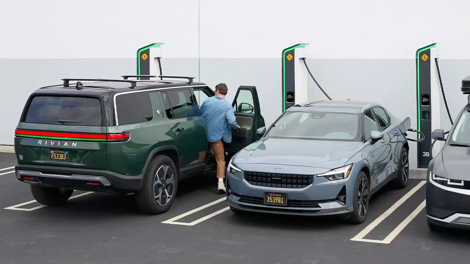 two cars charging at Rivian charging stations 