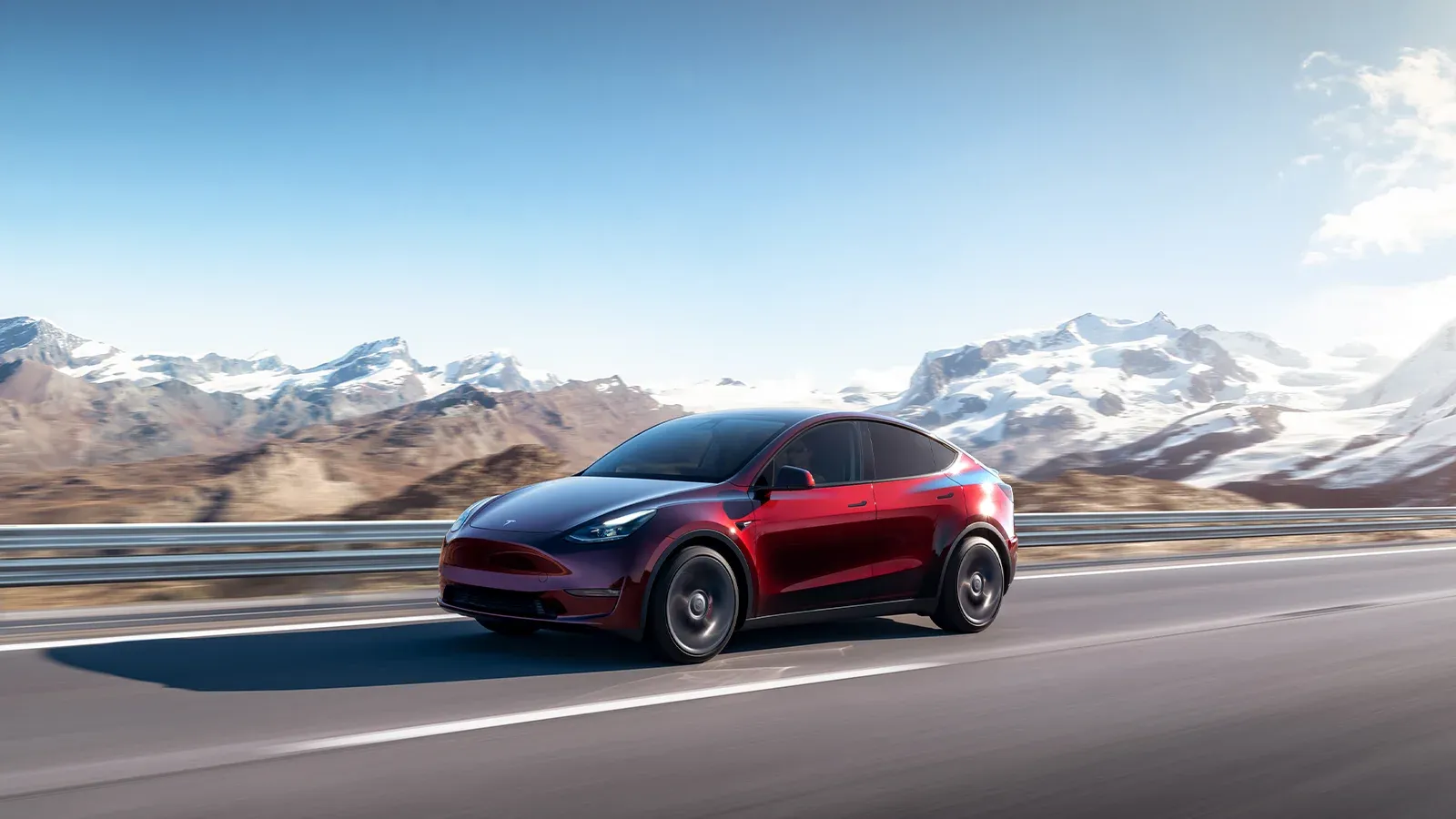 Tesla Model Y driving in the mountains 