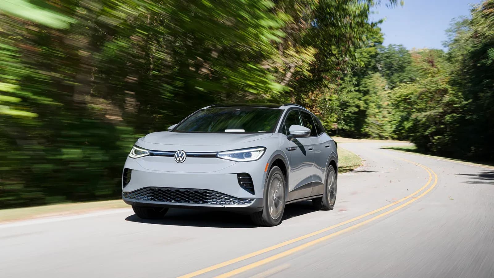 EV driving on the road in the summer