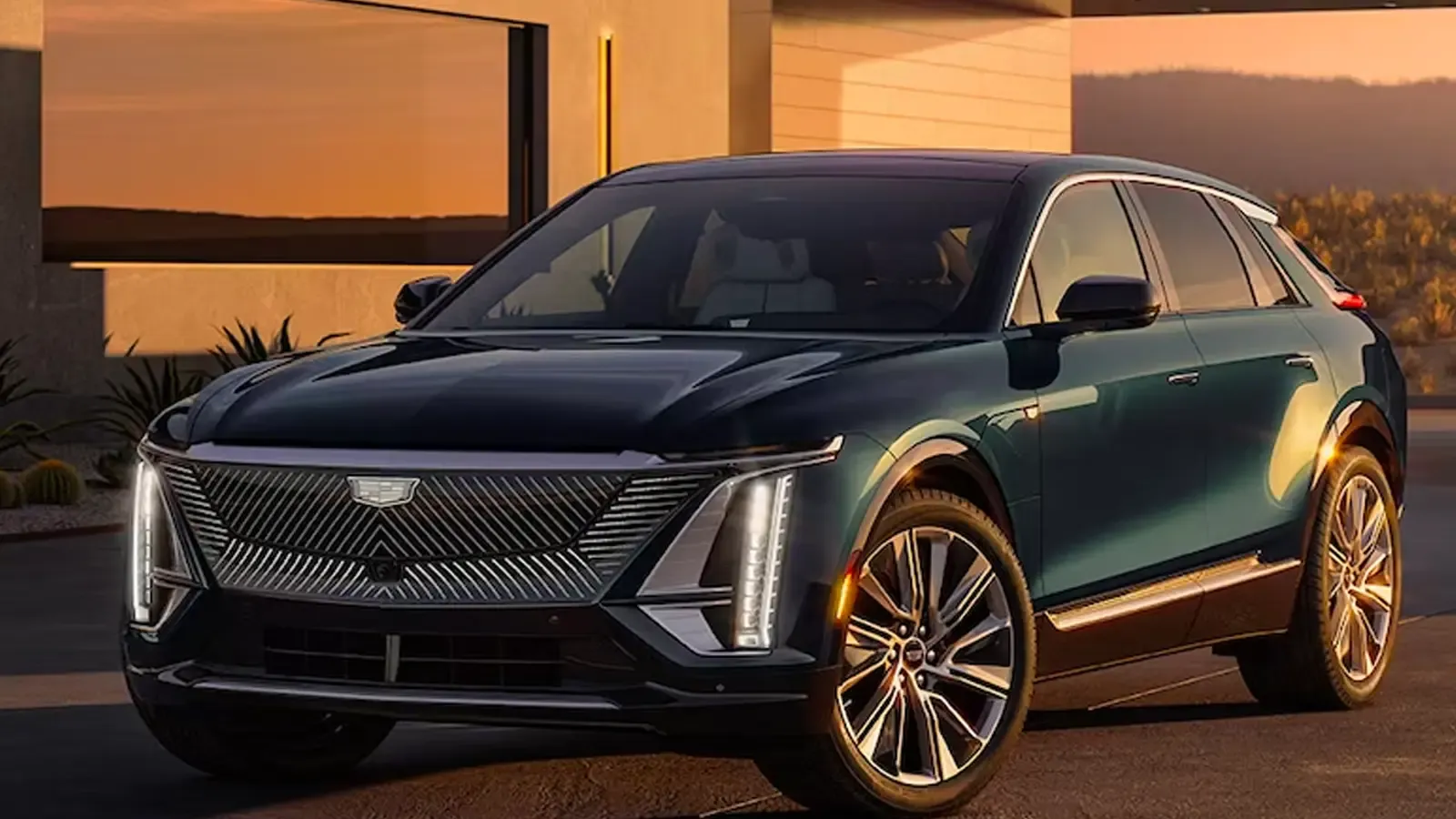 Cadillac Lyriq parked by a home during sunset 