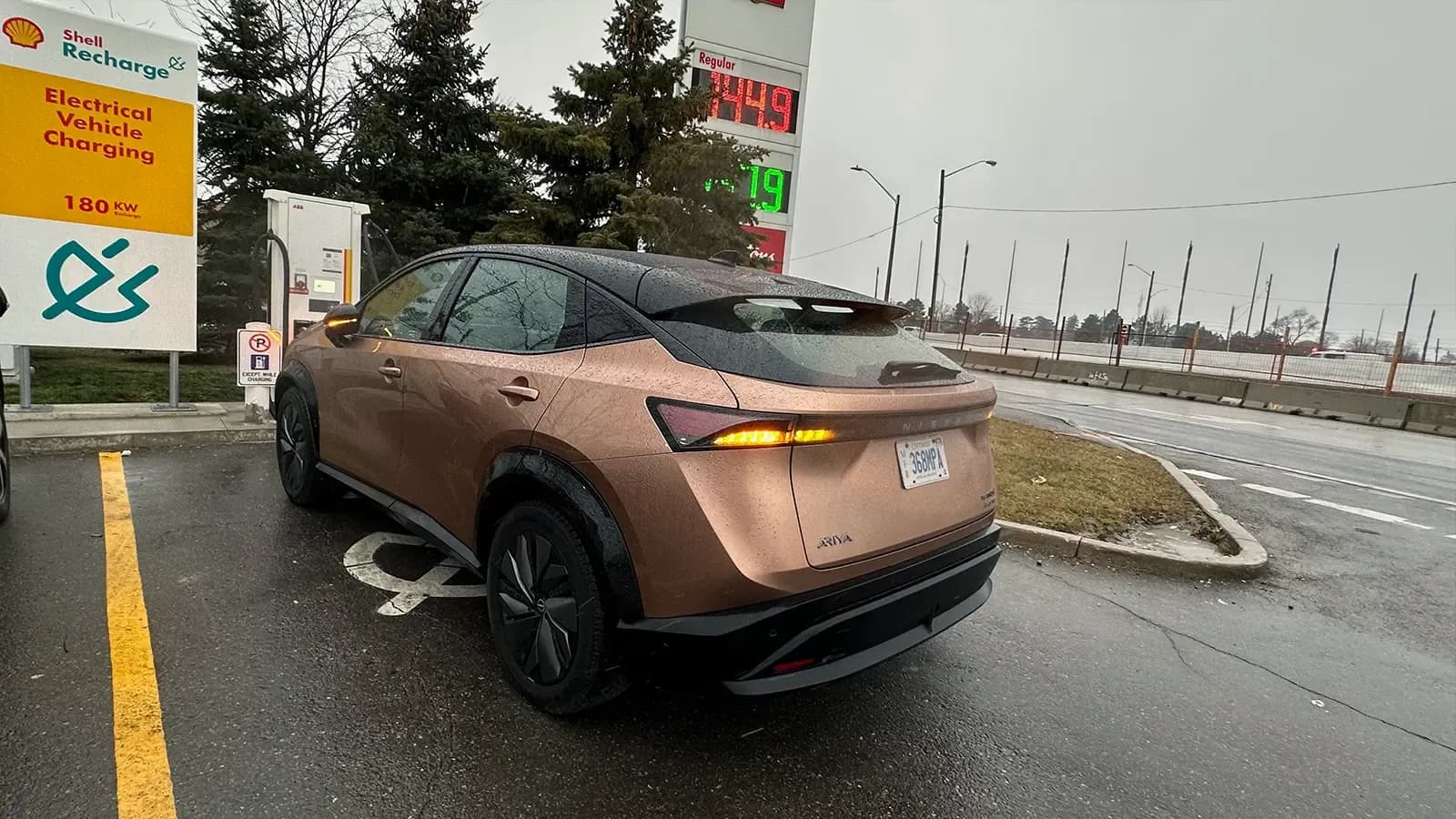 Nissan Ariya charging at gas station 