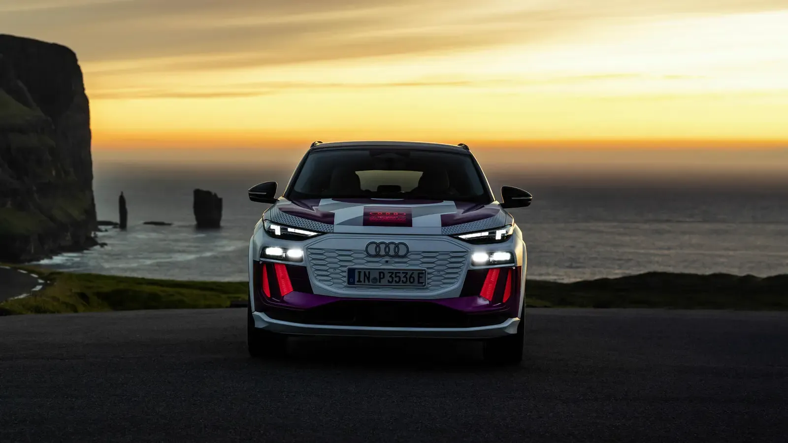 Audi Q6 e-tron prototype parked by the sea