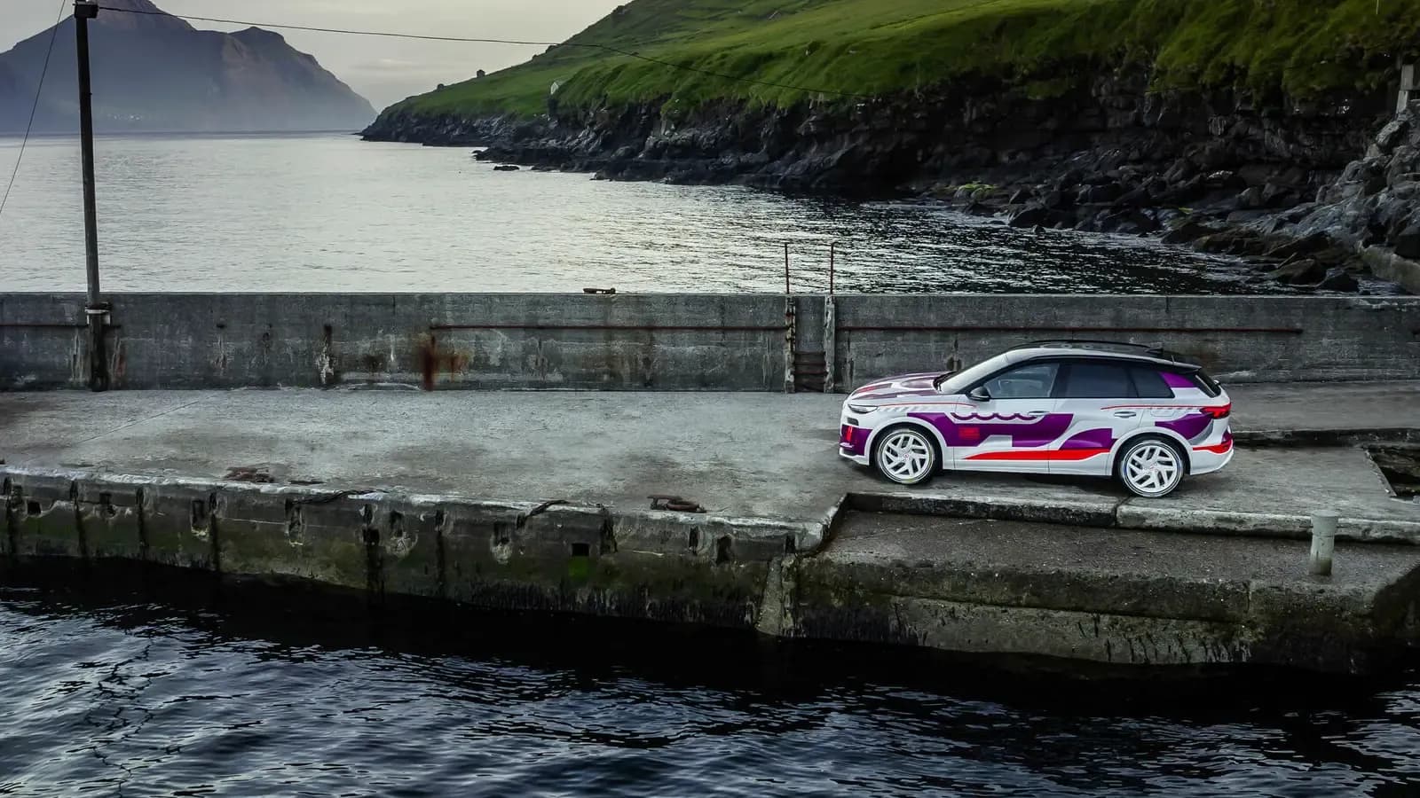Audi Q6 e-tron prototype parked by the sea
