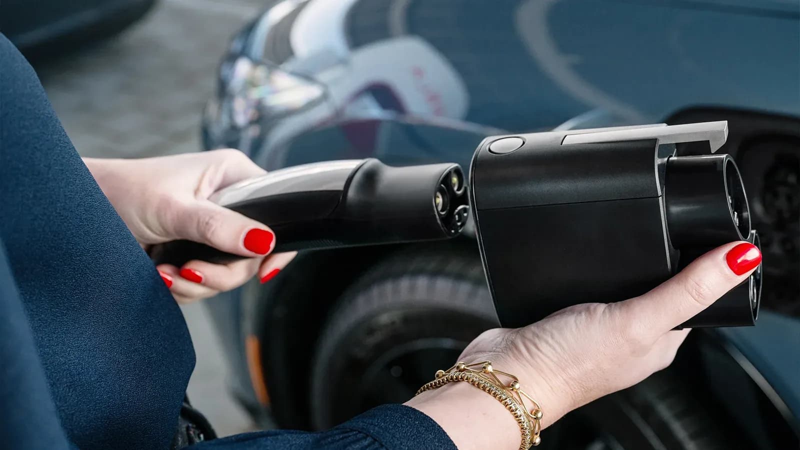 person setting up EV charger