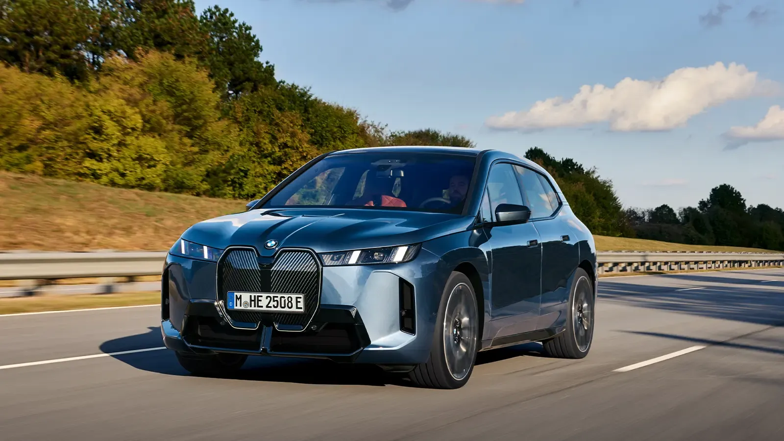 Driving shot of the 2026 BMW iX