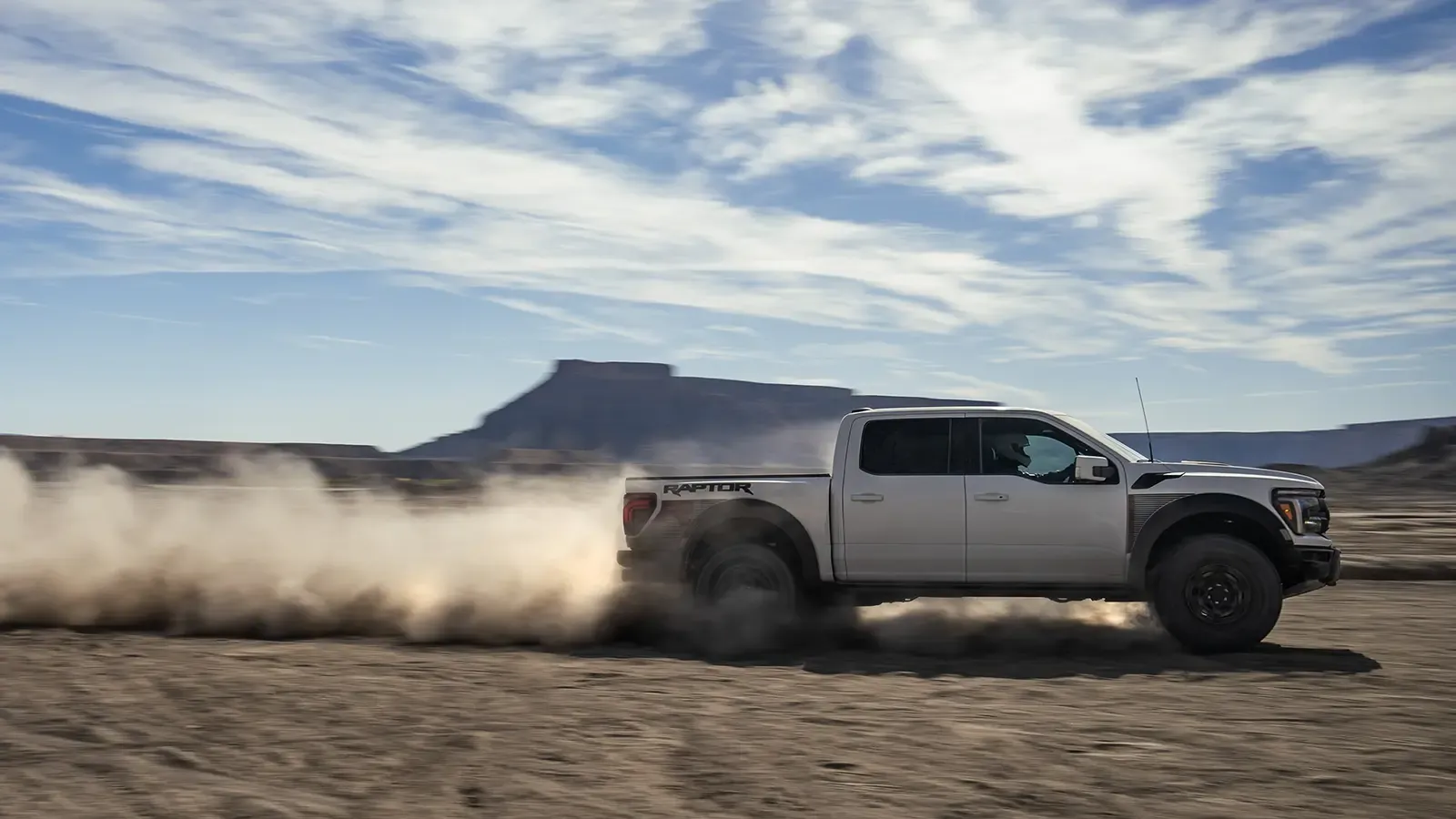A 2025 Ford F-150 Raptor racing across the desert