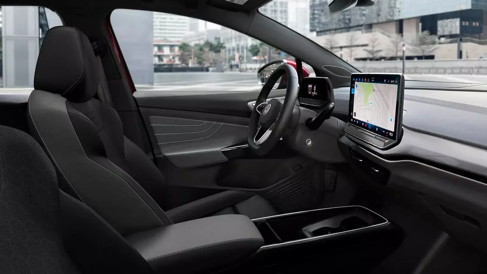 Volkswagen ID.4 interior with a steering wheel and center touchscreen.