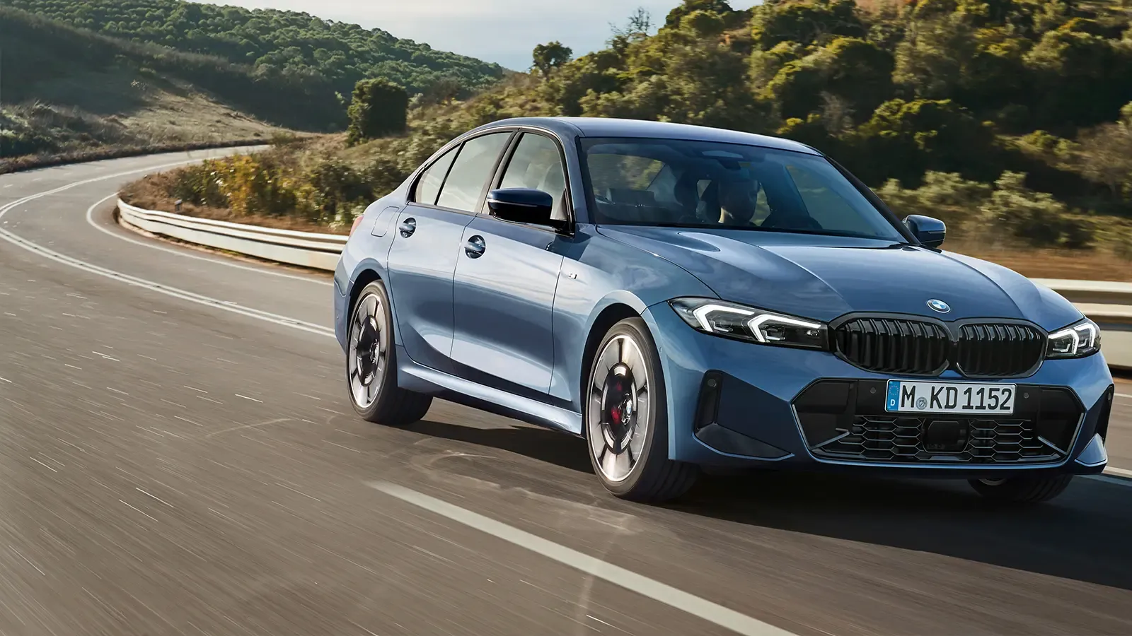 A blue 2025 BMW 330i