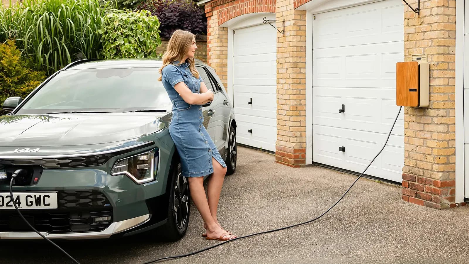 A women charging an ev car