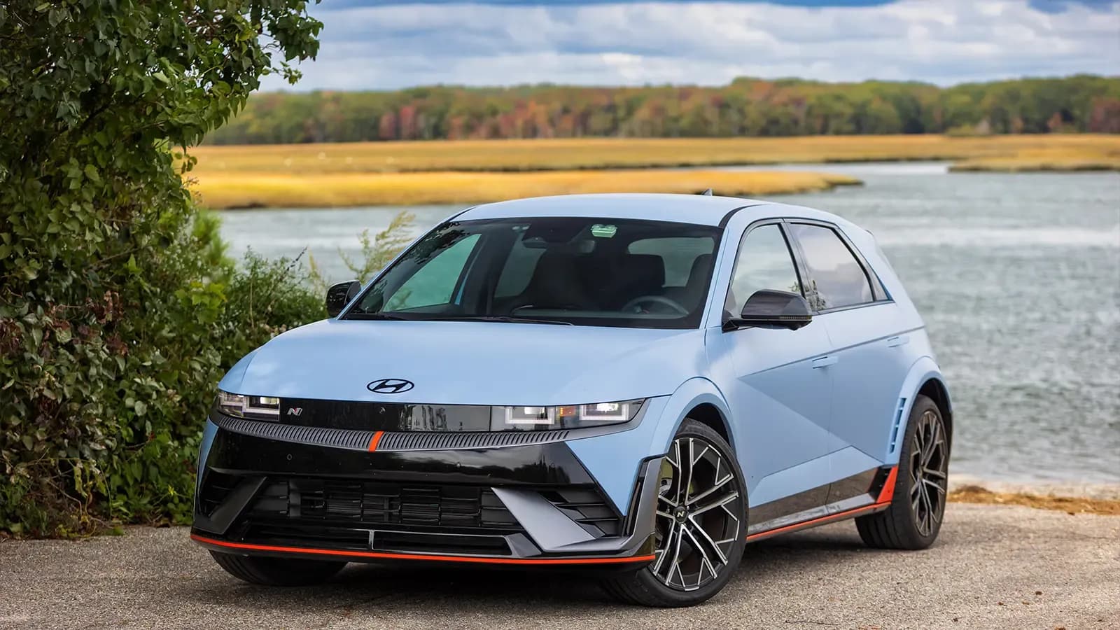 A 2025 blue Hyundai Ioniq 5 on a lake