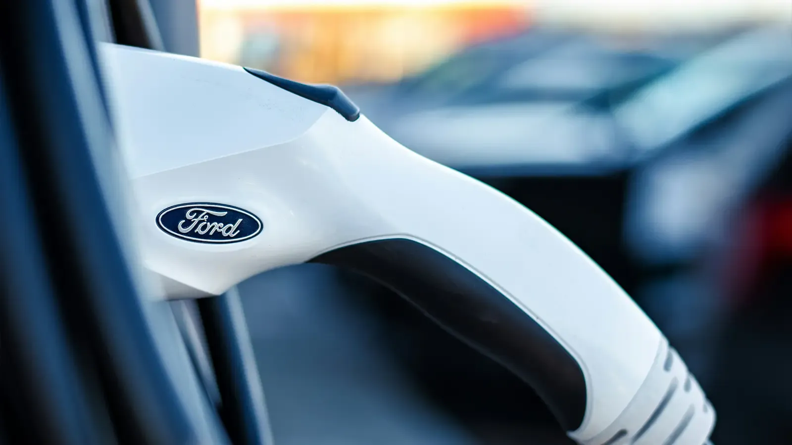 A Ford EV charger plugged into a vehicle