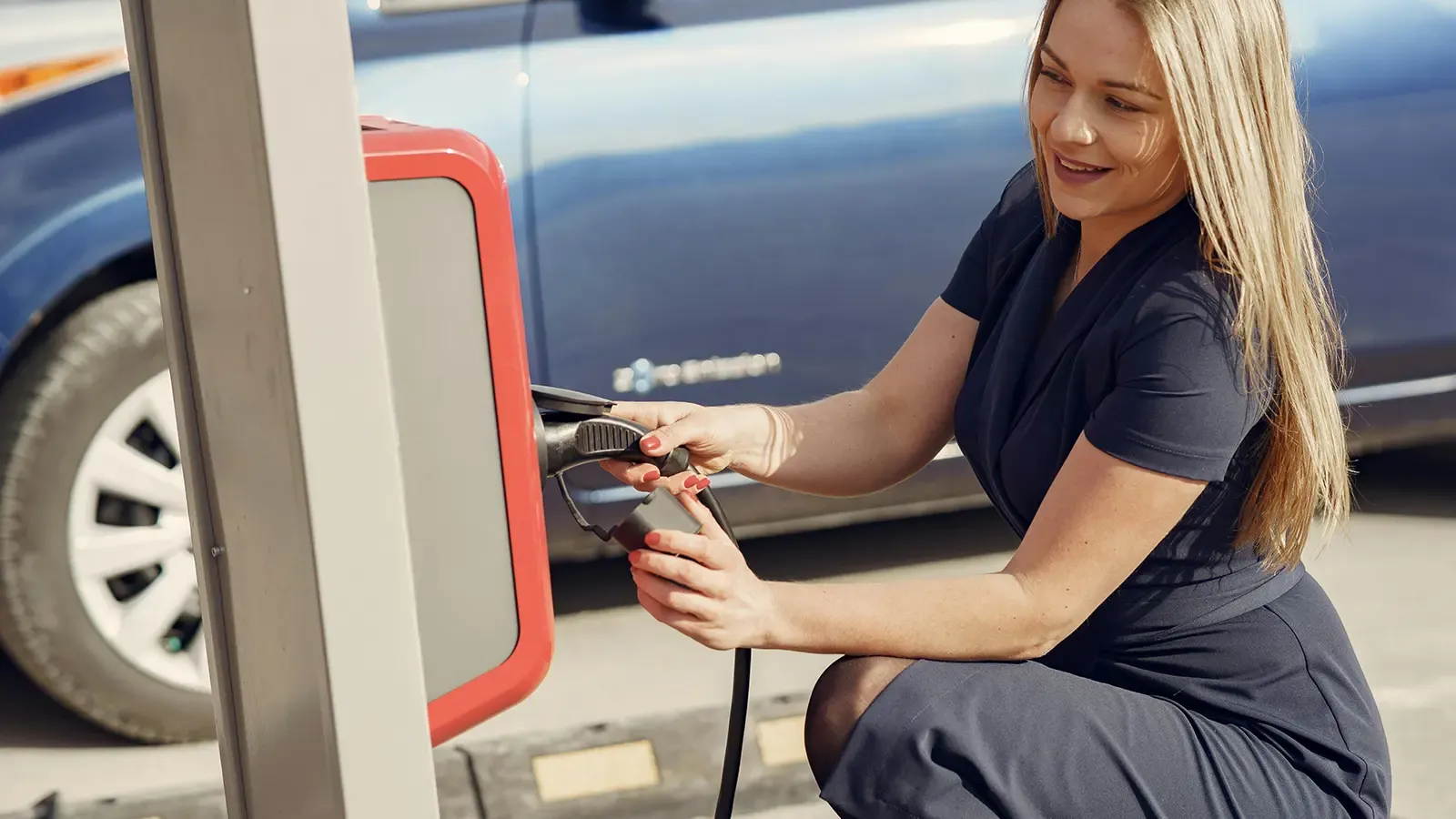 A woman charging her car in public