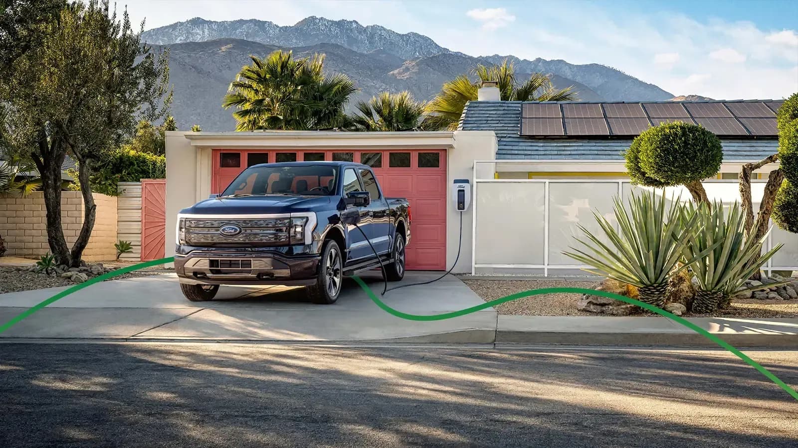 A Ford Lightning charging in driveway