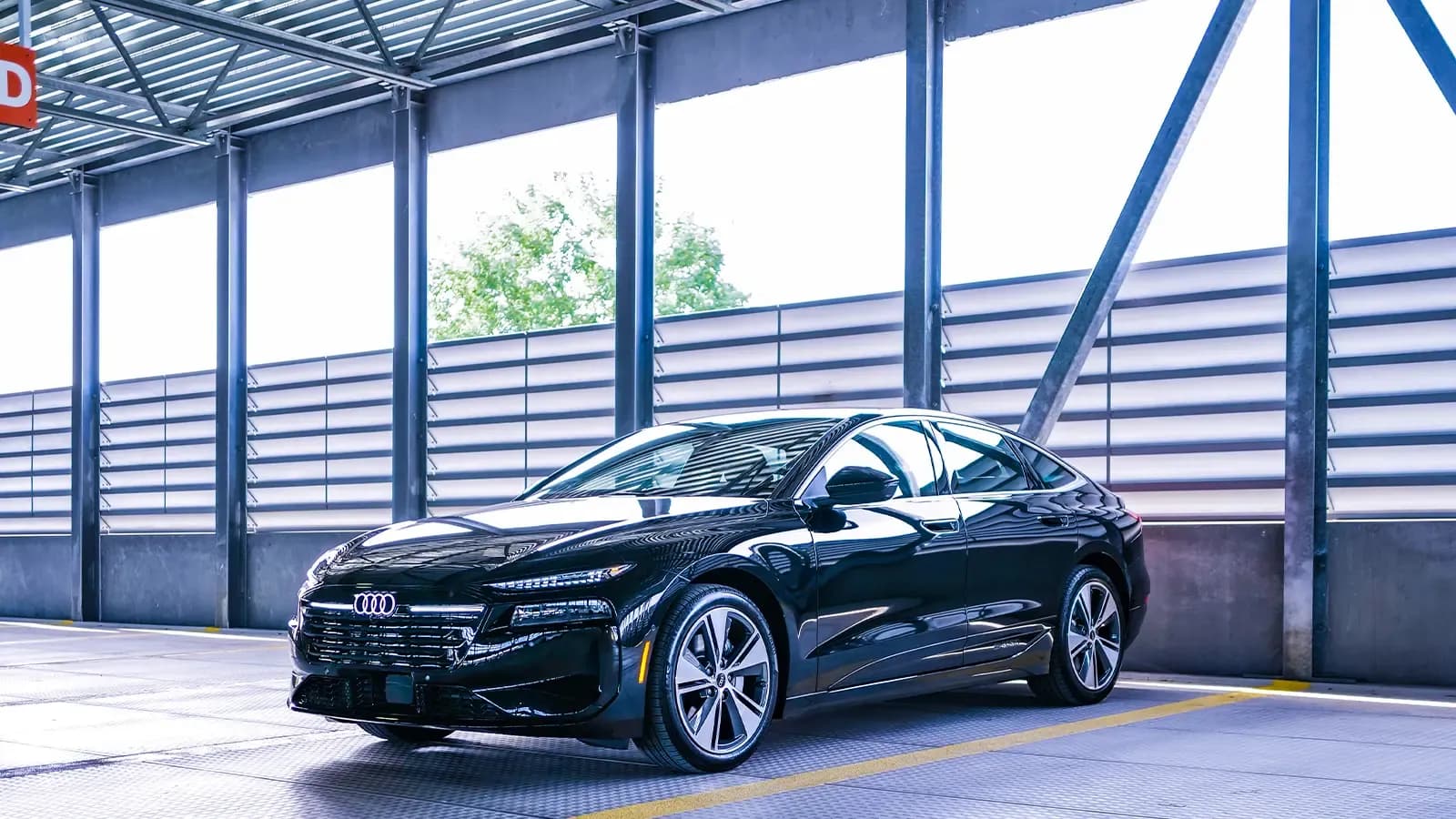 A black 2025 Audi A6 e-Tron side view