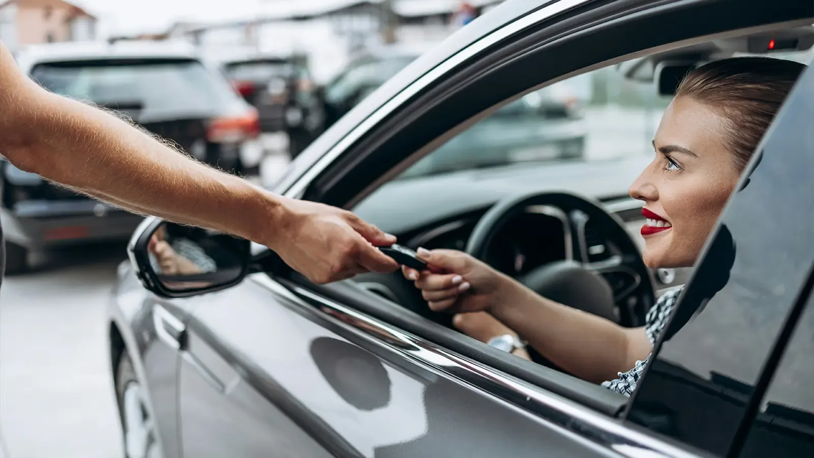 Couple shopping for a new car in a dealership