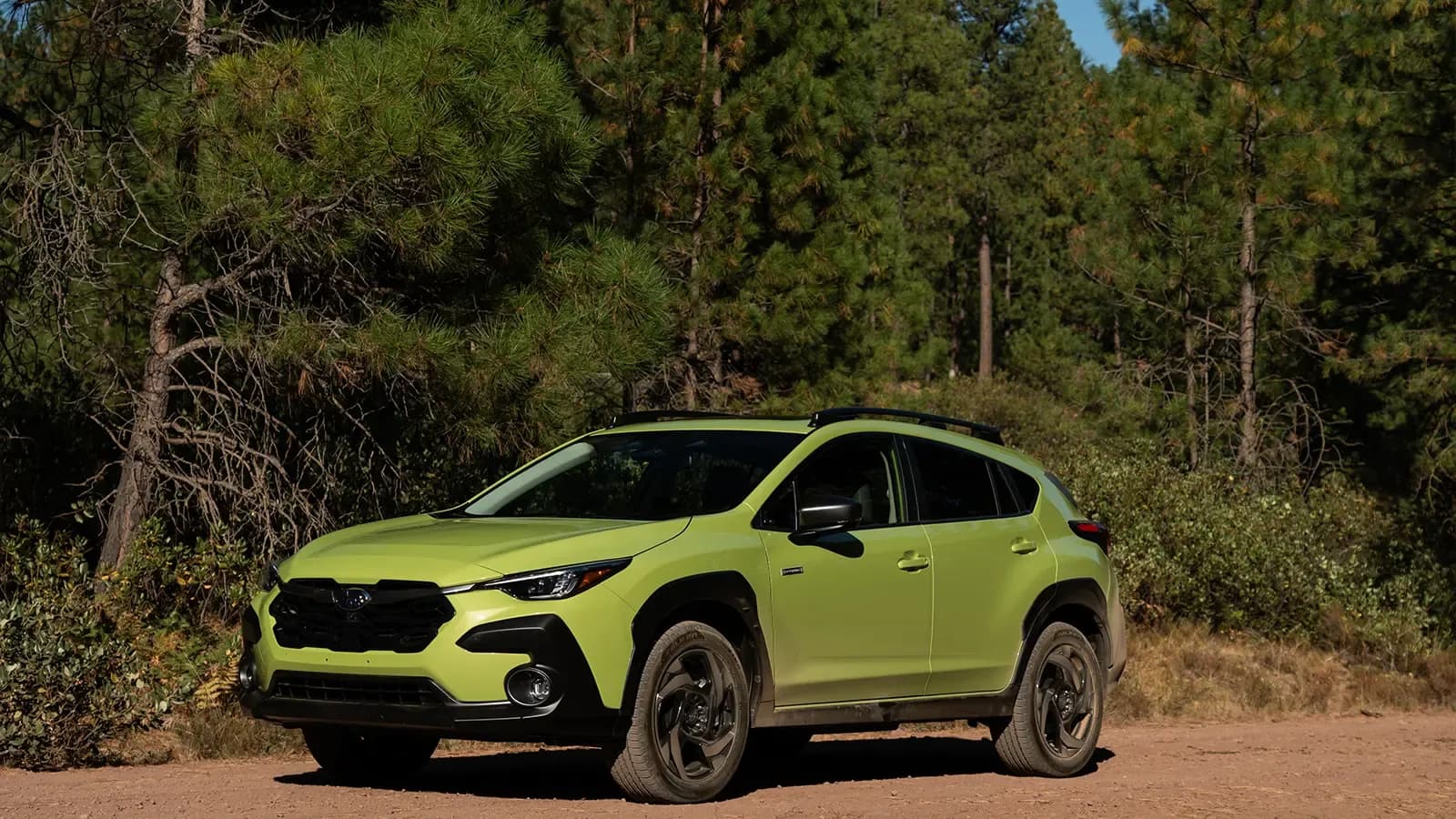 A green 2026 Subaru Crosstrek Hybrid side view