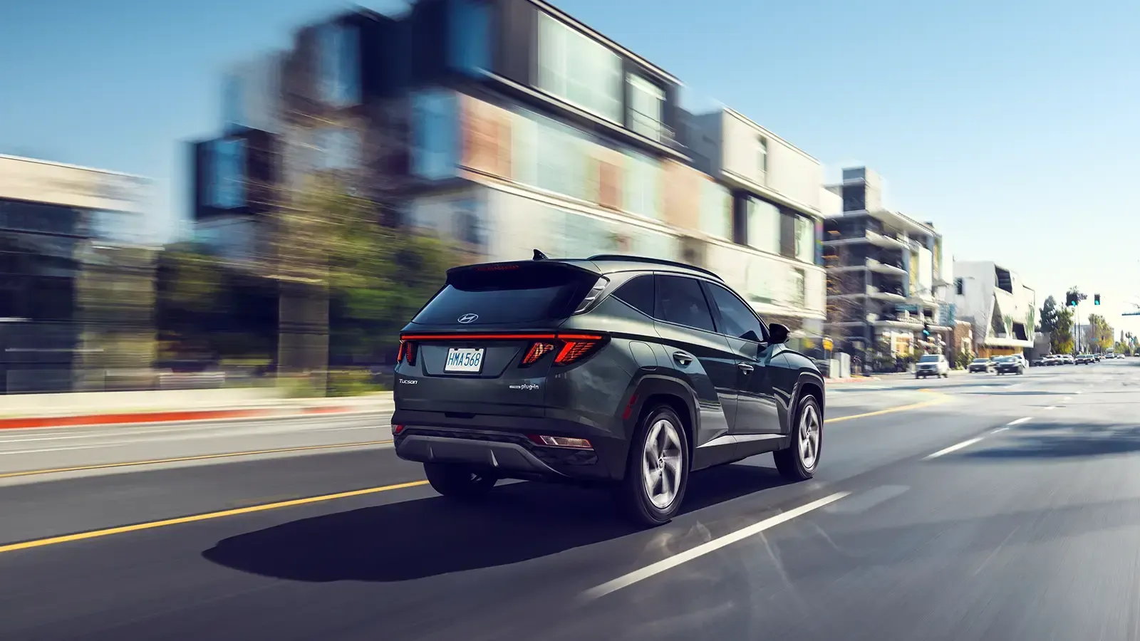 A Plug-in Hybrid car driving down street