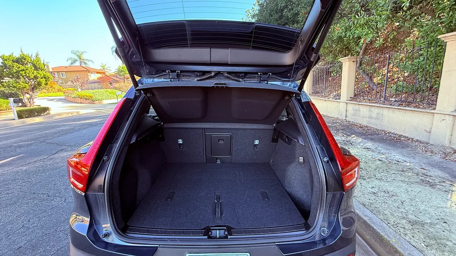 A 2026 dark blue Volvo XC40 cargo bay view with hatch open
