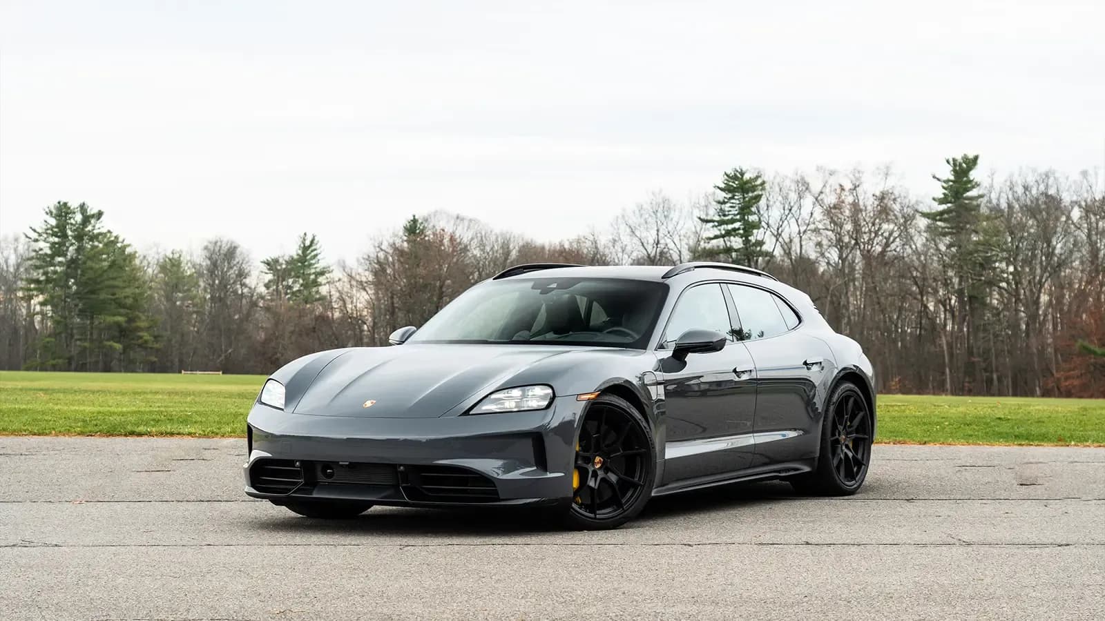 A dark gray 2025 Porsche Taycan GTS-3 front view three quarter view