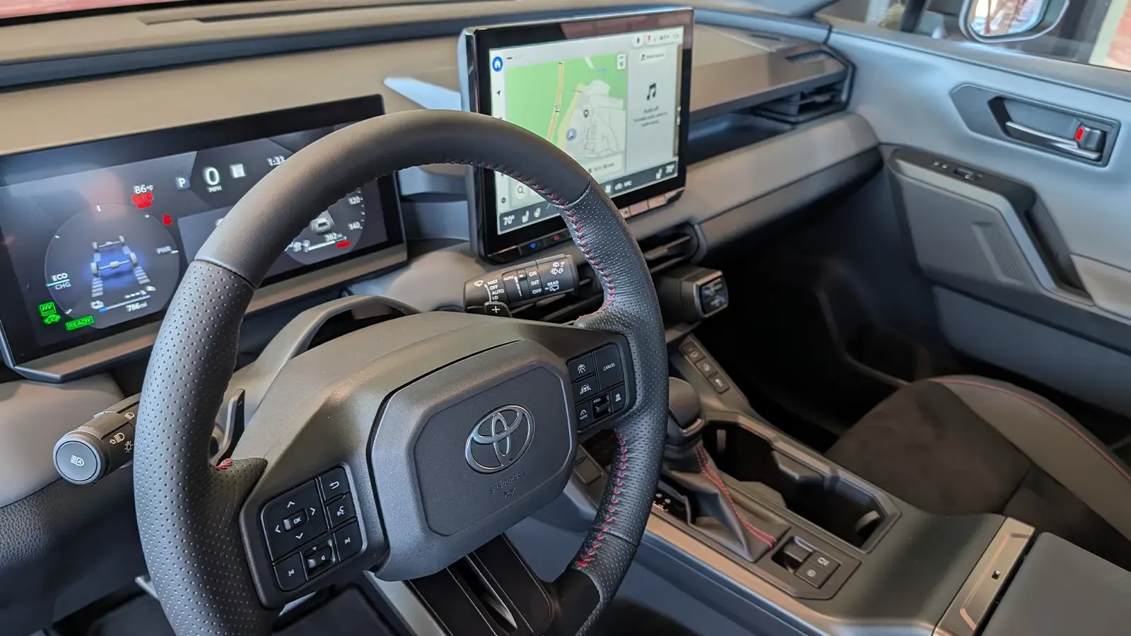 A dark gray 2025 Toyota RAV4 hybrid driver interior HUD view