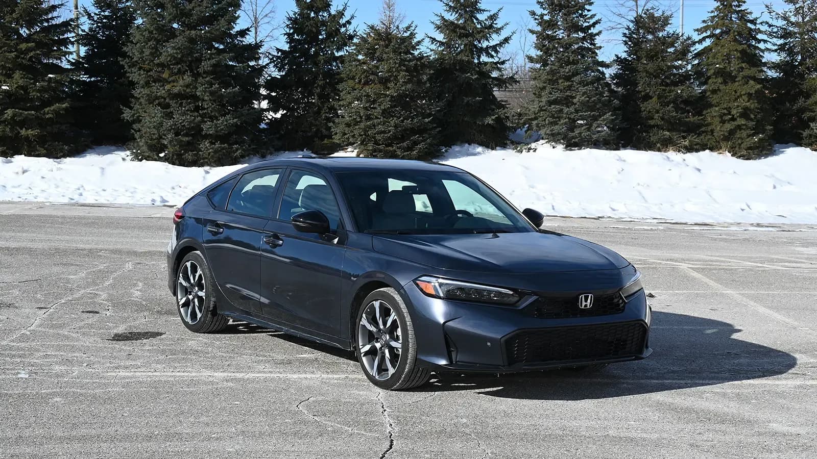 A black 2026 Honda Civic Sport Touring hybrid