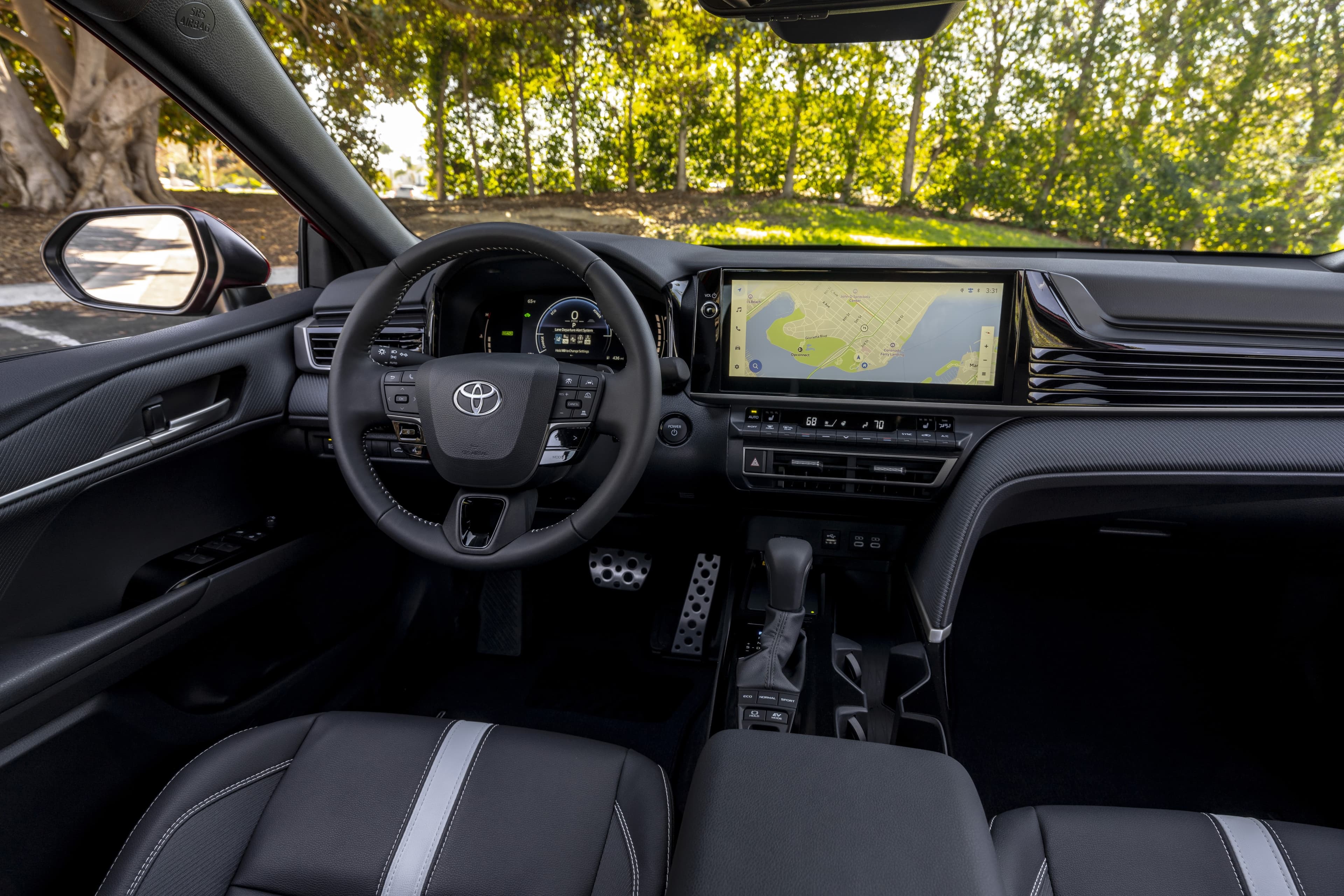 The interior view of the 2026 Toyota hybrid front driver HUD