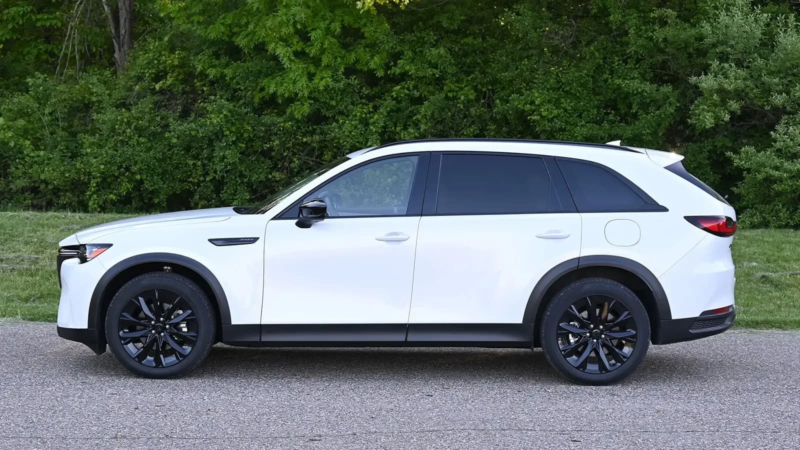 A White Mazda-CX-90 2026 side view in a parking lot