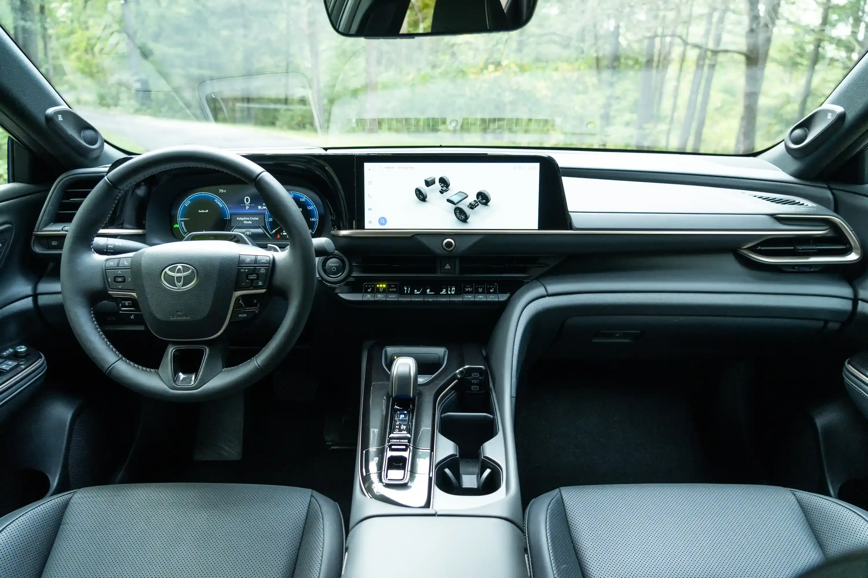 Toyota Crown interior showing the dashboard, digital gauge cluster, and center touchscreen.